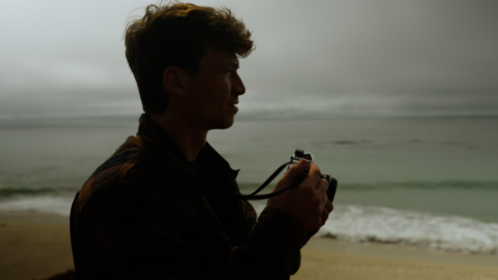 Dakota Martin photographing along the coast