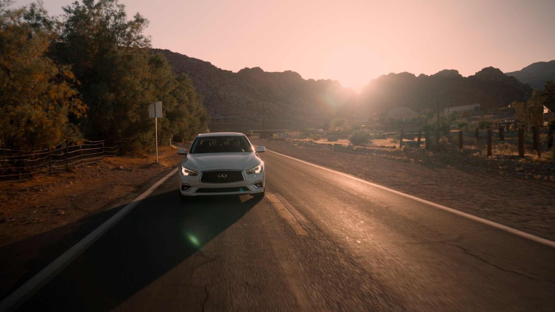 INFINITI driving through the desert
