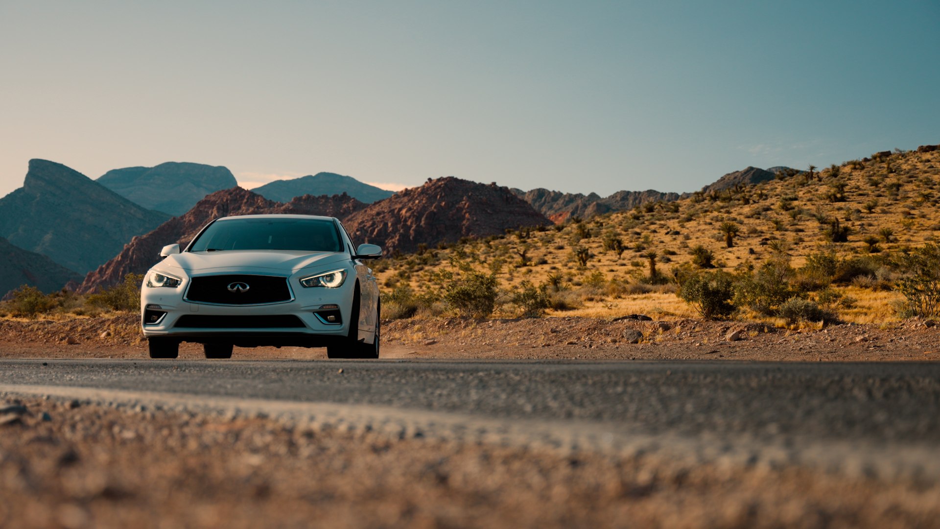 INFINITI vehicle framed in the desert
