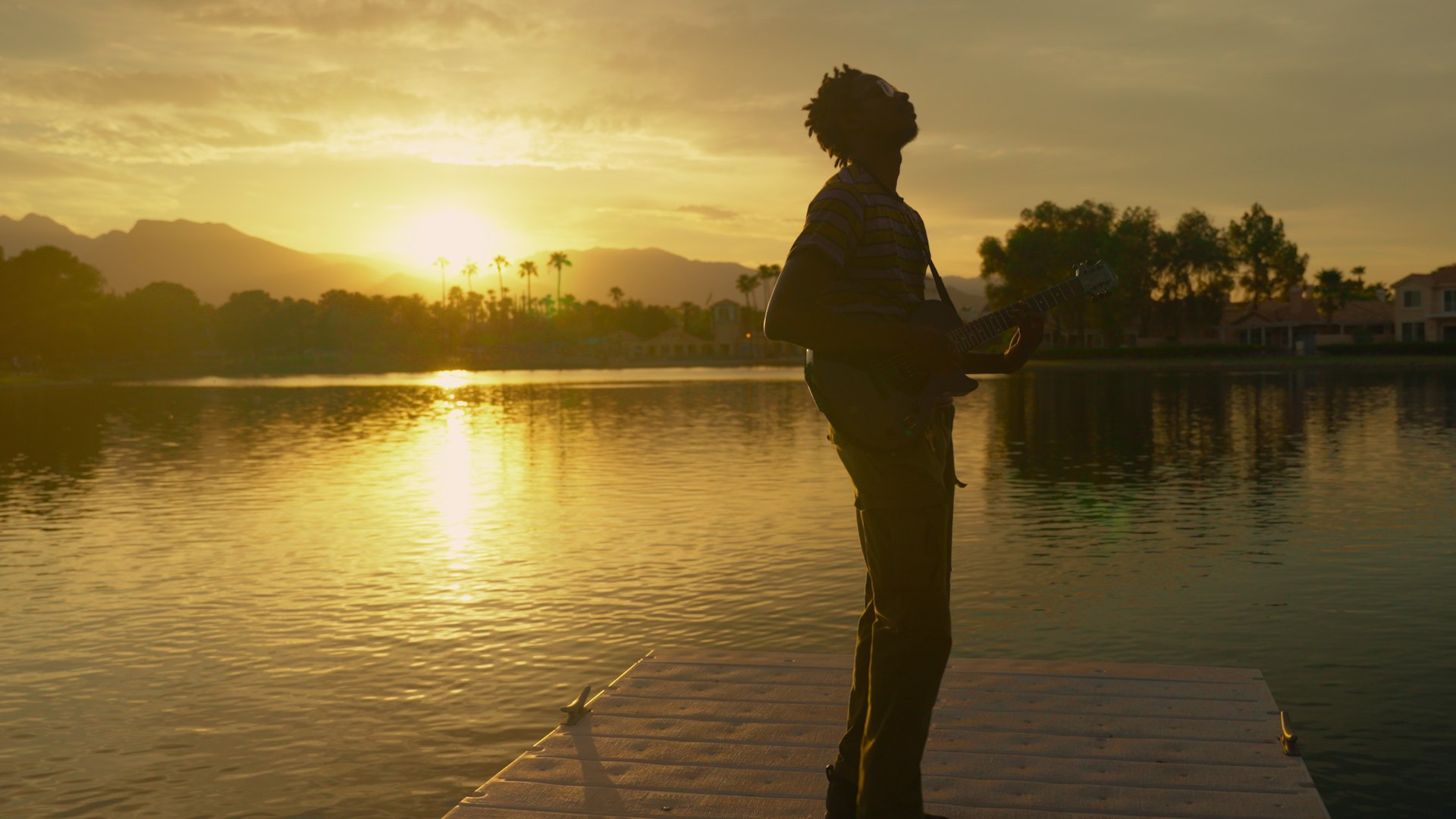 Artist silhouetted at sunset